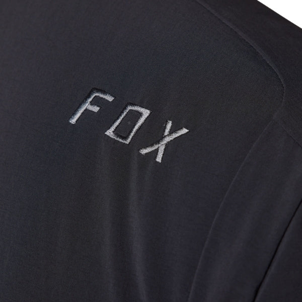Fox Racing Defend Fire Alpha Jacket (MTB) in Black, front product view, with the high collar or hood, full front zipper, zippered pockets, adjustable cuffs, shaped rear hem, and Fox chest logo. Available options—Color: Brown Sugar, Black; Size: SM, MD, LG, XL, 2X. SKU 33782-001-S. UPC 191972931659.