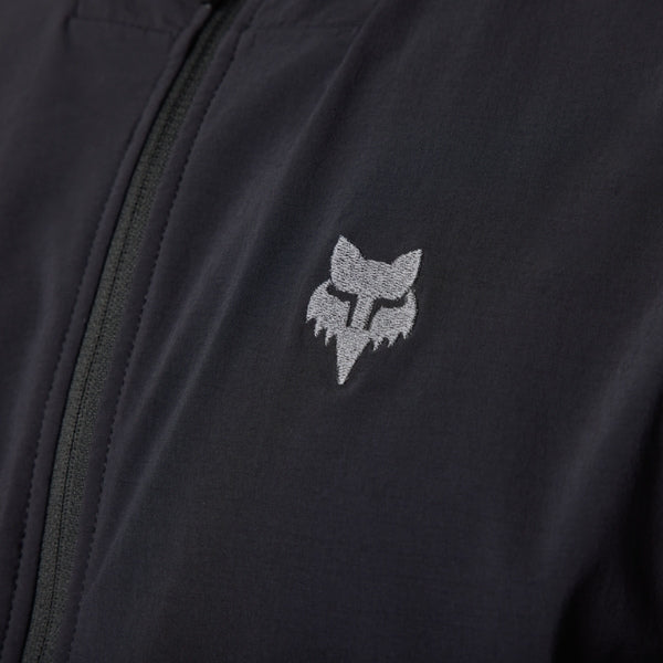 Fox Racing Defend Fire Alpha Jacket (MTB) in Black, full modeled front view, with the high collar or hood, full front zipper, zippered pockets, adjustable cuffs, shaped rear hem, and Fox chest logo. Available options—Color: Brown Sugar, Black; Size: SM, MD, LG, XL, 2X. SKU 33782-001-XL. UPC 191972931680.