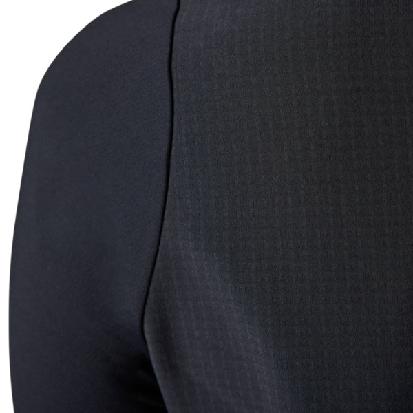 Fox Racing Defend Thermal Jersey (MTB) (Womens) in Black, close-up of the lower hem and drop-tail panel, with the printed Fox artwork, mesh-knit texture, reinforced seam lines, and shaped cuff or hem. Available options—Color: Brown Sugar, Black; Size: XS, SM, MD, LG, XL.