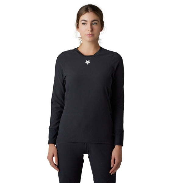 Fox Racing Defend Thermal Jersey (MTB) (Womens) in Black, full modeled front view, with the crew neck, long sleeves, contrasting shoulder and arm graphics, and extended rear hem on a rider. Available options—Color: Brown Sugar, Black; Size: XS, SM, MD, LG, XL.