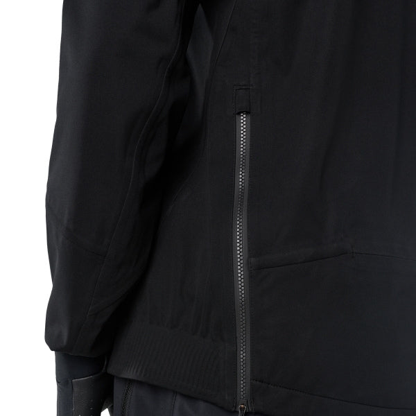 Fox Racing Flexair Water Pullover (MTB) in Black, close-up of the side opening or zipper, with the vertical side zipper, fitted sleeve, straight seam lines, and black stretch fabric. Available options—Color: Black; Size: SM, MD, LG, XL, 2X. SKU 40141-001-XL. UPC 198571108000.