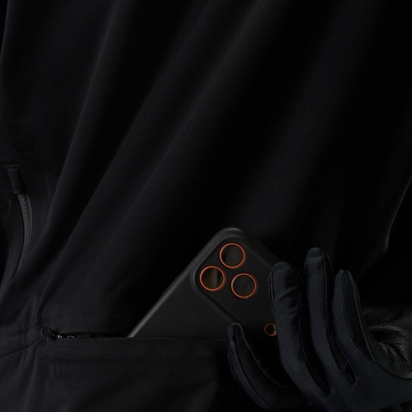Fox Racing Flexair Water Pullover (MTB) in Black, close-up of the interior fabric and pocket area, with the inner fabric pocket, three circular openings, black lining, and stitched edge. Available options—Color: Black; Size: SM, MD, LG, XL, 2X. SKU 40141-001-2X. UPC 198571108017.