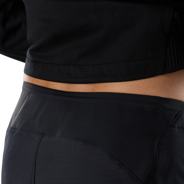 Fox Racing Flexair Fire Pants (MTB) in Black, close-up of the side thigh and knee panels, with the ratcheting waist adjuster, stretch yoke, shaped hip panel, and reinforced knee or thigh material. Available options—Color: Black, Nutmeg, Galaxy Blue; Size: 28, 30, 32, 34, 36, 38, 40. SKU 40142-001-36. UPC 198571106457.