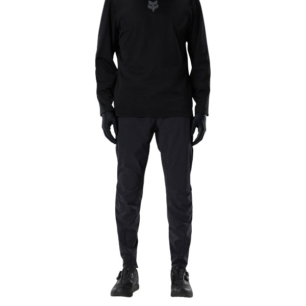 Fox Racing Flexair Fire Pants (MTB) in Black, full modeled front view, with the fitted waist, articulated knee shape, tapered legs, and reinforced riding panels on a rider. Available options—Color: Black, Nutmeg, Galaxy Blue; Size: 28, 30, 32, 34, 36, 38, 40. SKU 40142-001-40. UPC 198571106471.