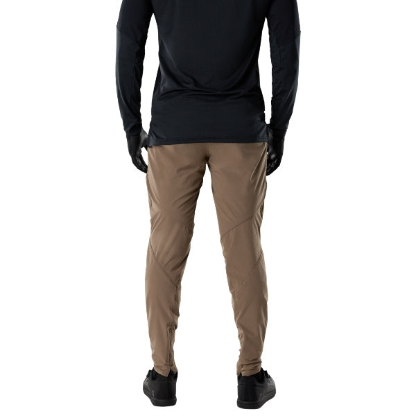 Fox Racing Flexair Fire Pants (MTB) in Nutmeg, full modeled front view, with the fitted waist, articulated knee shape, tapered legs, and reinforced riding panels on a rider. Available options—Color: Black, Nutmeg, Galaxy Blue; Size: 28, 30, 32, 34, 36, 38, 40. SKU 40142-512-40. UPC 198571117675.