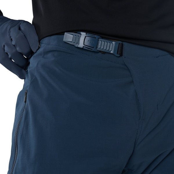 Fox Racing Flexair Fire Pants (MTB) in Galaxy Blue, close-up of the waist and hip panels, with the ratcheting waist adjuster, stretch yoke, shaped hip panel, and reinforced knee or thigh material. Available options—Color: Black, Nutmeg, Galaxy Blue; Size: 28, 30, 32, 34, 36, 38, 40. SKU 40142-D17-32. UPC 198571113400.