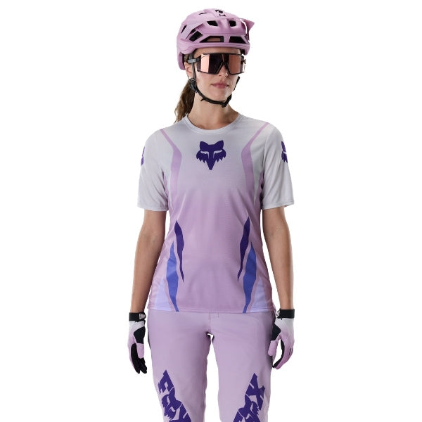 Fox Racing Ranger Foundry Jersey (MTB) (Womens) in Lavender Drift, close-up of the sleeve graphic and cuff, with the printed Fox artwork, mesh-knit texture, reinforced seam lines, and shaped cuff or hem. Available options—Color: Lavender Drift; Size: XS, SM, MD, LG, XL. SKU 40168-F07-XL. UPC 198571115435.