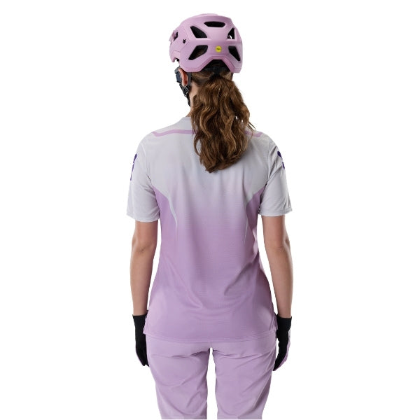 Fox Racing Ranger Foundry Jersey (MTB) (Womens) in Lavender Drift, close-up of the lower hem and drop-tail panel, with the printed Fox artwork, mesh-knit texture, reinforced seam lines, and shaped cuff or hem. Available options—Color: Lavender Drift; Size: XS, SM, MD, LG, XL.