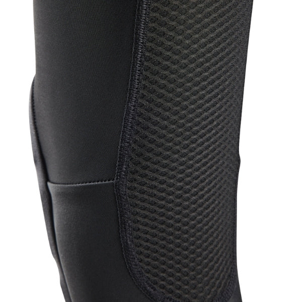 Fox Racing Enduro Knee Sleeve (Youth) in Black, close-up of the ventilated protective insert, with the flexible black sleeve, molded impact pad, mesh ventilation, elastic cuff, and Fox logo. Available options—Color: Black.