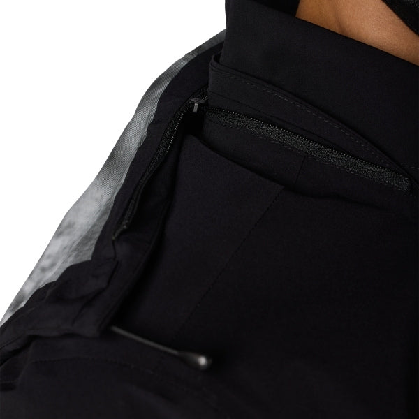 Fox Racing Ranger OR Packable Rain Jacket in Black, full modeled front view, with the high collar or hood, full front zipper, zippered pockets, adjustable cuffs, shaped rear hem, and Fox chest logo. Available options—Color: Black, Ivy; Size: SM, MD, LG, XL, 2X, 3X. SKU 38699-001-XL. UPC 198571062975.
