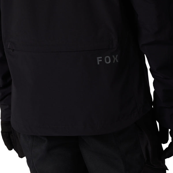 Fox Racing Ranger OR Packable Rain Jacket in Black, full modeled rear view, with the high collar or hood, full front zipper, zippered pockets, adjustable cuffs, shaped rear hem, and Fox chest logo. Available options—Color: Black, Ivy; Size: SM, MD, LG, XL, 2X, 3X. SKU 38699-001-2X. UPC 198571062982.