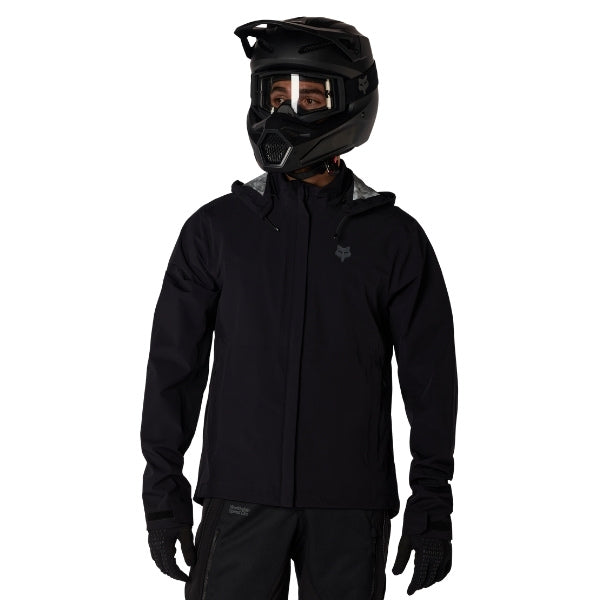 Fox Racing Ranger OR Packable Rain Jacket in Black, close-up of the shoulder logo, with the high collar or hood, full front zipper, zippered pockets, adjustable cuffs, shaped rear hem, and Fox chest logo. Available options—Color: Black, Ivy; Size: SM, MD, LG, XL, 2X, 3X. SKU 38699-001-3X. UPC 198571062999.