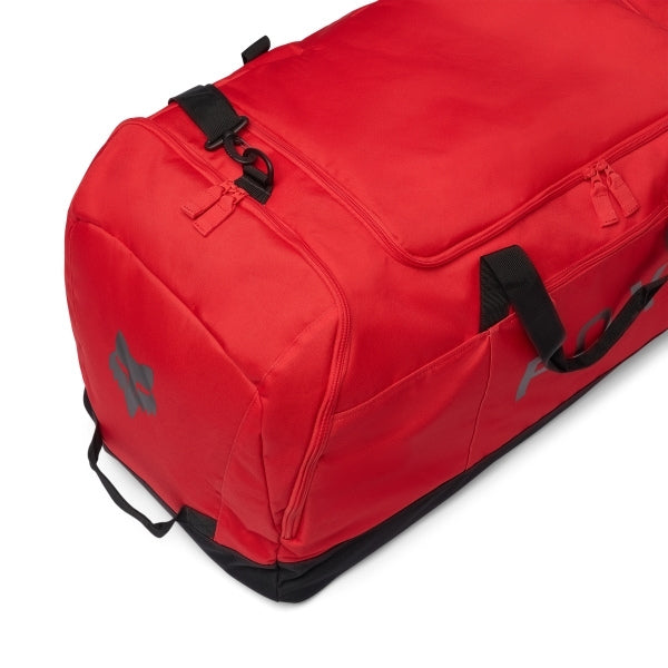 Fox Racing Podium Duffle in Blue Jewel, long-side view, with the main zippered compartment, reinforced base, carry handles, end pocket, wheels, and large Fox logo. Available options—Color: Black, Red, Blue Jewel.