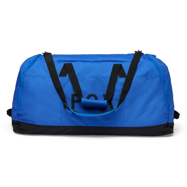 Fox Racing Podium Duffle in Blue Jewel, end-panel and carry-handle view, with the main zippered compartment, reinforced base, carry handles, end pocket, wheels, and large Fox logo. Available options—Color: Black, Red, Blue Jewel.