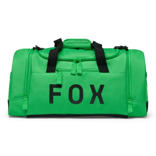 Fox Racing 180 Duffle in Orange, three-quarter view of the wheeled base and zippered compartments, with the main zippered compartment, reinforced base, carry handles, end pocket, wheels, and large Fox logo. Available options—Color: Black, Vivid Green, Orange.