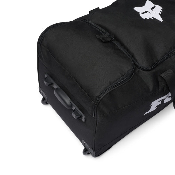 Fox Racing 180 Roller Bag in Midnight, long-side view, with the main zippered compartment, reinforced base, carry handles, end pocket, wheels, and large Fox logo. Available options—Color: Black, Pewter, Midnight. SKU 40540-329-OS. UPC 198571127070.