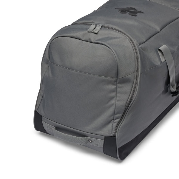 Fox Racing 180 Roller Bag in Midnight, opposite long-side view, with the main zippered compartment, reinforced base, carry handles, end pocket, wheels, and large Fox logo. Available options—Color: Black, Pewter, Midnight.