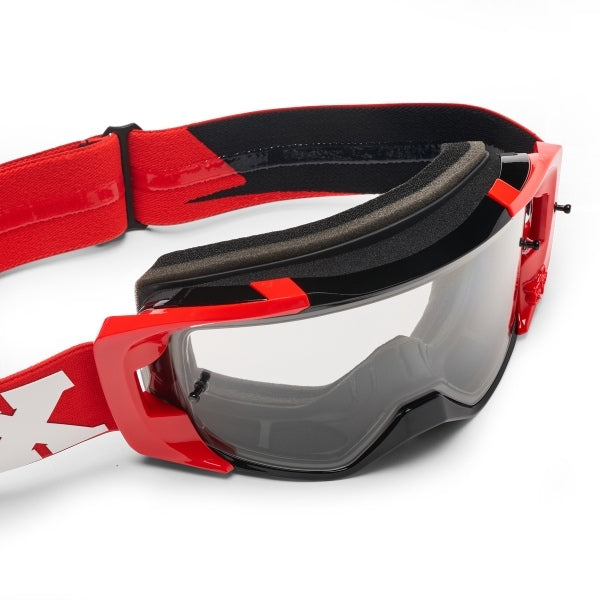 Fox Racing Vue Core Goggles in Red, side view of the frame and strap attachment, with the wide elastic strap, silicone grip bands, woven Fox lettering, and rear frame edge. Available options—Color: Black, Blue Jewel, Red.