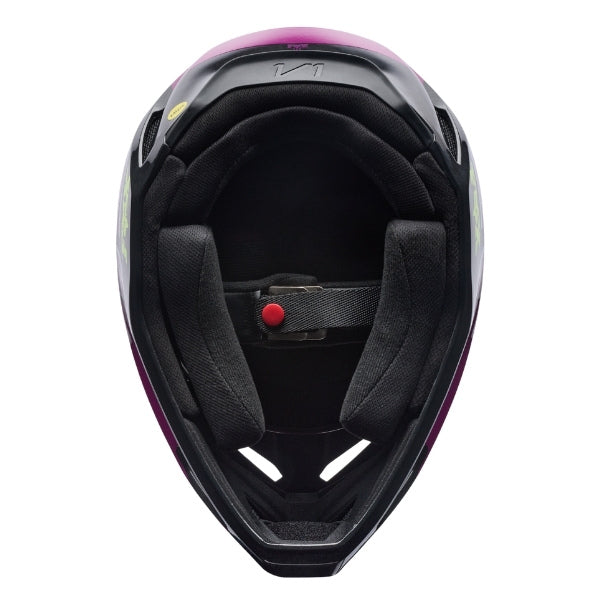 Fox Racing V1 Raid Helmet in Purple Lava, underside view of the interior padding and chin opening, with the padded crown liner, cheek pads, chin opening, and retention-strap area exposed. Available options—Color: Rust, Purple Lava, Emerald; Size: XS, SM, MD, LG, XL, 2X. SKU 40616-E07-2X. UPC 198571129180.