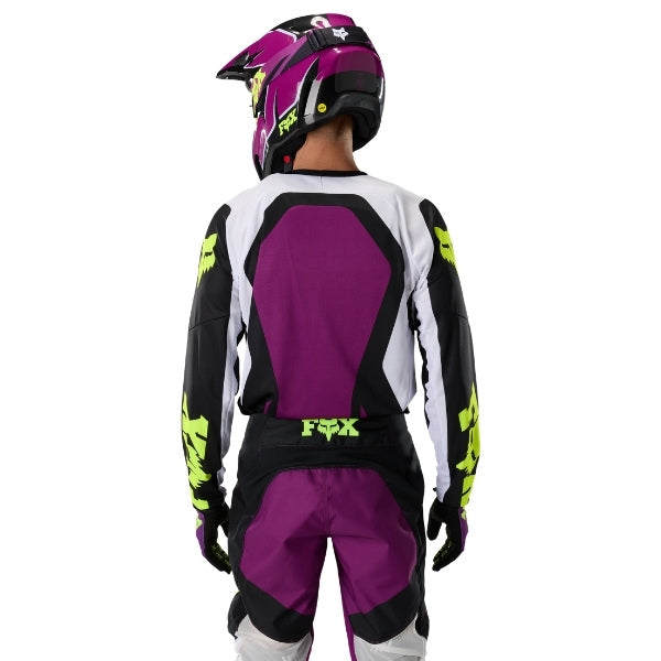 Fox Racing 180 Raid Jersey in Purple Lava, close-up of the lower hem and drop-tail panel, with the printed Fox artwork, mesh-knit texture, reinforced seam lines, and shaped cuff or hem. Available options—Color: Rust, Purple Lava, Deep Fern; Size: XS, SM, MD, LG, XL, 2X. SKU 40655-E07-2X. UPC 198571129272.