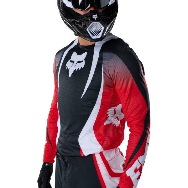 Fox Racing Flexair Thorn Jersey in Red, close-up of the sleeve graphic and cuff, with the printed Fox artwork, mesh-knit texture, reinforced seam lines, and shaped cuff or hem. Available options—Color: Black/White, Purple Lava, Red; Size: SM, MD, LG, XL, 2X. SKU 40658-003-2X. UPC 198571130216.