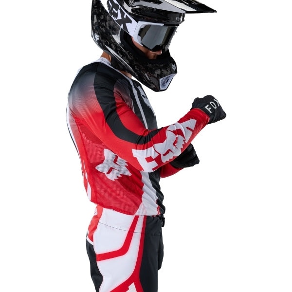 Fox Racing Flexair Thorn Jersey in Red, close-up of the lower hem and drop-tail panel, with the printed Fox artwork, mesh-knit texture, reinforced seam lines, and shaped cuff or hem. Available options—Color: Black/White, Purple Lava, Red; Size: SM, MD, LG, XL, 2X.