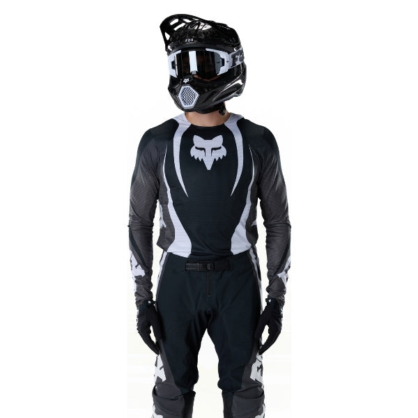 Fox Racing Flexair Thorn Jersey in Black/White, close-up of the sleeve graphic and cuff, with the printed Fox artwork, mesh-knit texture, reinforced seam lines, and shaped cuff or hem. Available options—Color: Black/White, Purple Lava, Red; Size: SM, MD, LG, XL, 2X. SKU 40658-018-2X. UPC 198571123768.