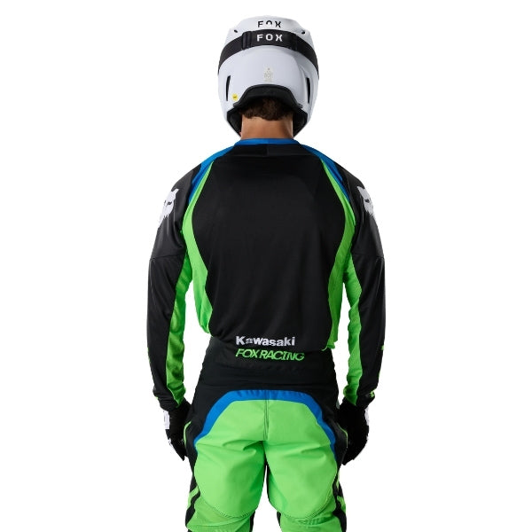 Fox Racing 180 Kawasaki Jersey in Black, close-up of the lower hem and drop-tail panel, with the printed Fox artwork, mesh-knit texture, reinforced seam lines, and shaped cuff or hem. Available options—Color: Black; Size: XS, SM, MD, LG, XL, 2X. SKU 40667-001-2X. UPC 198571121856.