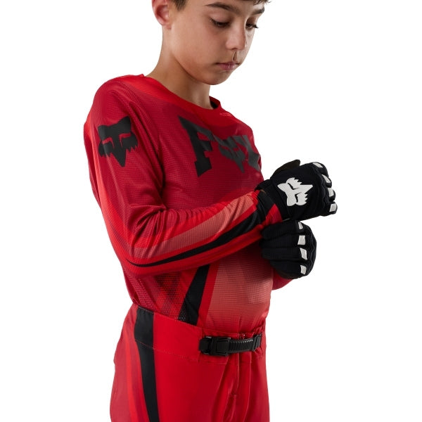 Fox Racing Flexair Arc Jersey (Youth) in Chili, close-up of the lower hem and drop-tail panel, with the printed Fox artwork, mesh-knit texture, reinforced seam lines, and shaped cuff or hem. Available options—Color: Ice Blue, Chili; Size: Y-SM, Y-MD, Y-LG, Y-XL.
