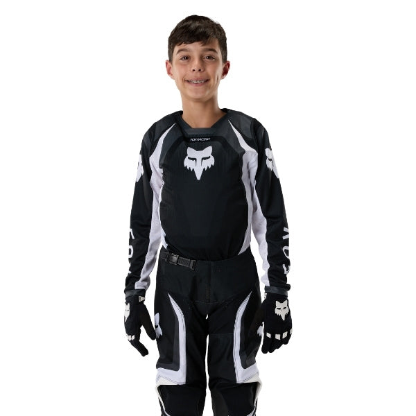 Fox Racing 180 Frame Jersey (Youth) in Red, rear product view, with the back graphic, shoulder panels, long sleeves, and drop-tail hem. Available options—Color: Blue, Grey/Yellow, Black, Red; Size: Y-SM, Y-MD, Y-LG, Y-XL. SKU 40672-003-YM. UPC 198571129999.
