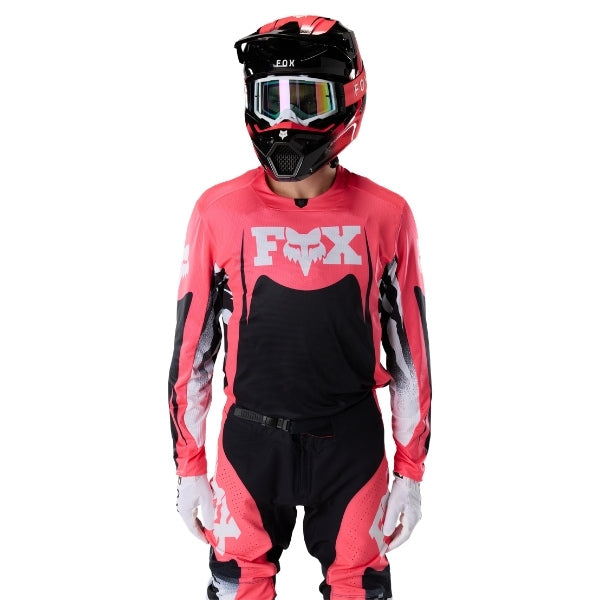 Fox Racing 360 Clutch Jersey in Neon Pink, close-up of the lower hem and drop-tail panel, with the printed Fox artwork, mesh-knit texture, reinforced seam lines, and shaped cuff or hem. Available options—Color: White/Black, Neon Pink; Size: SM, MD, LG, XL, 2X.