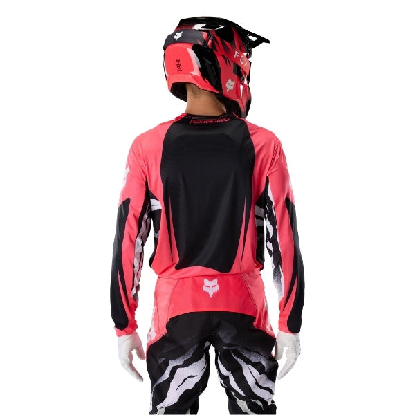 Fox Racing 360 Clutch Jersey in Neon Pink, full modeled front view, with the crew neck, long sleeves, contrasting shoulder and arm graphics, and extended rear hem on a rider. Available options—Color: White/Black, Neon Pink; Size: SM, MD, LG, XL, 2X.