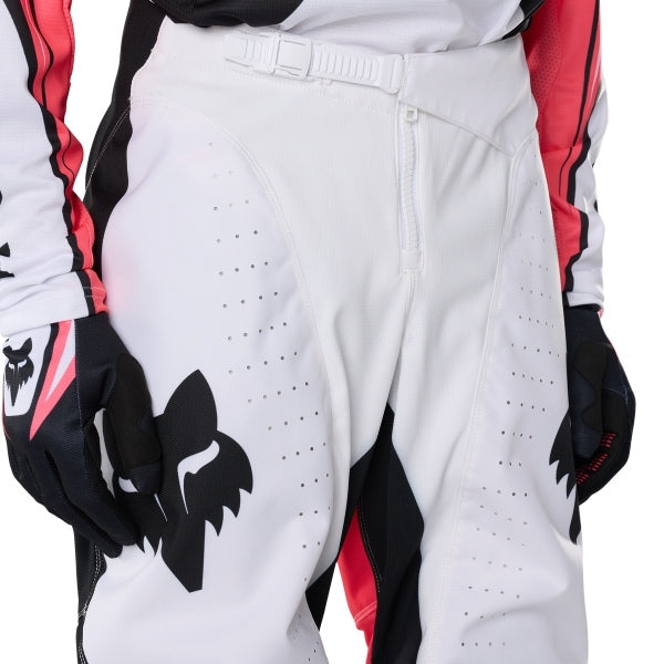 Fox Racing 180 Draft Pants in White, close-up of the waist and hip panels, with the ratcheting waist adjuster, stretch yoke, shaped hip panel, and reinforced knee or thigh material. Available options—Color: White, Black, Sunburst; Size: 28, 30, 32, 34, 36, 38. SKU 40687-008-32. UPC 198571132166.
