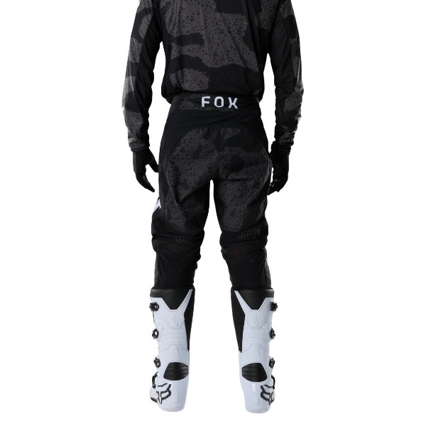 Fox Racing 180 BNKR Pants in Black Camo, rear lower-leg and cuff view, with the reinforced seat, rear yoke, articulated knees, tapered legs, and lower-leg graphics. Available options—Color: Black Camo; Size: 26, 28, 30, 32, 34, 36, 38. SKU 40694-247-36. UPC 198571133699.