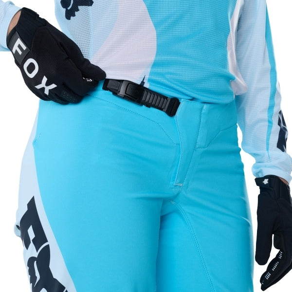 Fox Racing Flexair Thorn Pants (Womens) in Sky Blue, front product view, with the adjustable waist, articulated knees, contrasting leg graphics, reinforced inner knees, and tapered cuffs. Available options—Color: Black/Pink, Sky Blue; Size: 2, 4, 6, 8, 10, 12, 14, 16. SKU 40698-D67-2. UPC 198571131404.
