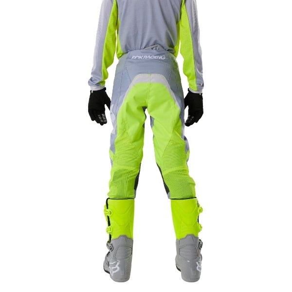 Fox Racing 180 Frame Pants (Youth) in Black, close-up of the ratcheting waist closure, with the ratcheting waist adjuster, stretch yoke, shaped hip panel, and reinforced knee or thigh material. Available options—Color: Blue, Grey/Yellow, Black, Red; Size: Y-22, Y-24, Y-26, Y-28. SKU 40702-001-28. UPC 198571122815.