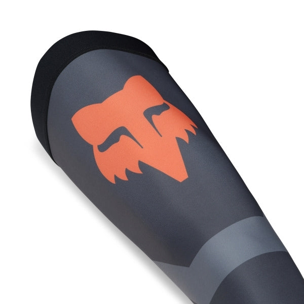 Fox Racing Flexair Knee Brace Socks in Grey, close-up of the reinforced heel and ankle, with the ribbed cuff, knitted Fox graphics, shaped heel, reinforced toe, and ventilated stretch knit. Available options—Color: Black, Blue, Red, Grey; Size: MD, LG.