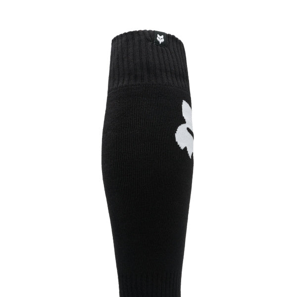 Fox Racing 180 Elevated Core Socks in Black, rear calf graphic view, with the ribbed cuff, knitted Fox graphics, shaped heel, reinforced toe, and ventilated stretch knit. Available options—Color: Black, Midnight, Red, Grey; Size: SM, MD, LG. SKU 40716-001-M. UPC 198571122457.