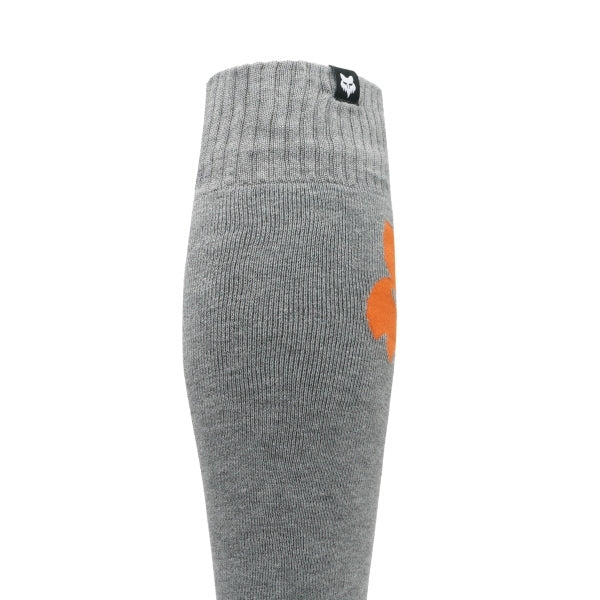 Fox Racing 180 Elevated Core Socks in Grey, full side profile, with the ribbed cuff, knitted Fox graphics, shaped heel, reinforced toe, and ventilated stretch knit. Available options—Color: Black, Midnight, Red, Grey; Size: SM, MD, LG. SKU 40716-006-S. UPC 198571125854.