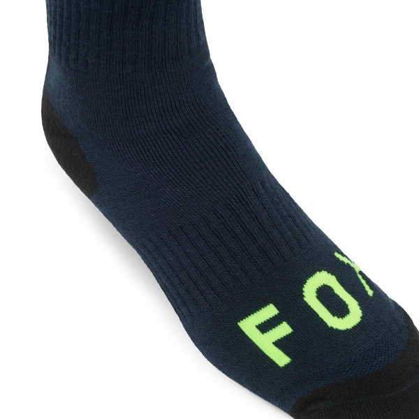 Fox Racing 180 Elevated Core Socks in Red, full side profile, with the ribbed cuff, knitted Fox graphics, shaped heel, reinforced toe, and ventilated stretch knit. Available options—Color: Black, Midnight, Red, Grey; Size: SM, MD, LG. SKU 40716-003-S. UPC 198571129920.