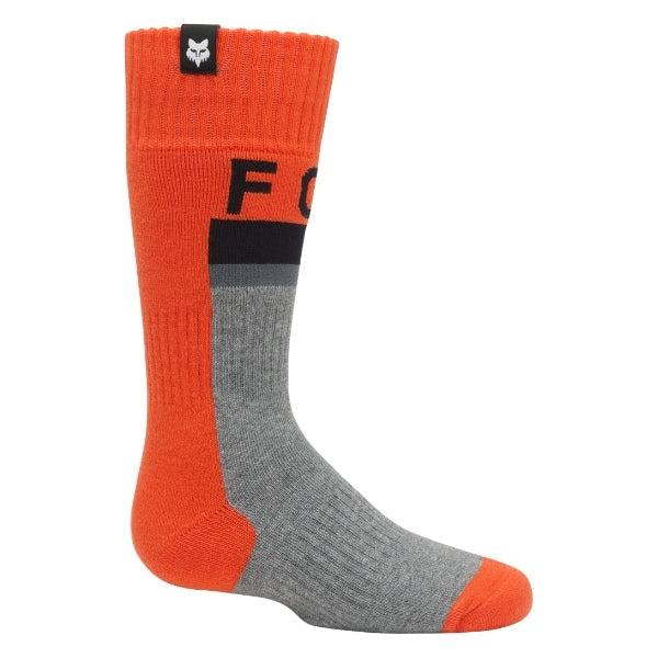 Fox Racing 180 Core Socks (Youth) in Orange, full side profile, with the ribbed cuff, knitted Fox graphics, shaped heel, reinforced toe, and ventilated stretch knit. Available options—Color: Orange, HiViz Yellow; Size: Y-SM, Y-LG. SKU 40718-009-YS. UPC 198571128794.