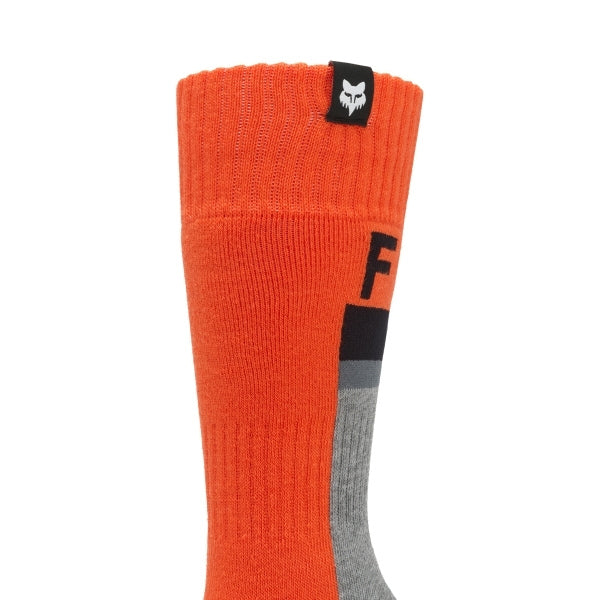 Fox Racing 180 Core Socks (Youth) in Orange, rear calf graphic view, with the ribbed cuff, knitted Fox graphics, shaped heel, reinforced toe, and ventilated stretch knit. Available options—Color: Orange, HiViz Yellow; Size: Y-SM, Y-LG. SKU 40718-009-YL. UPC 198571128800.