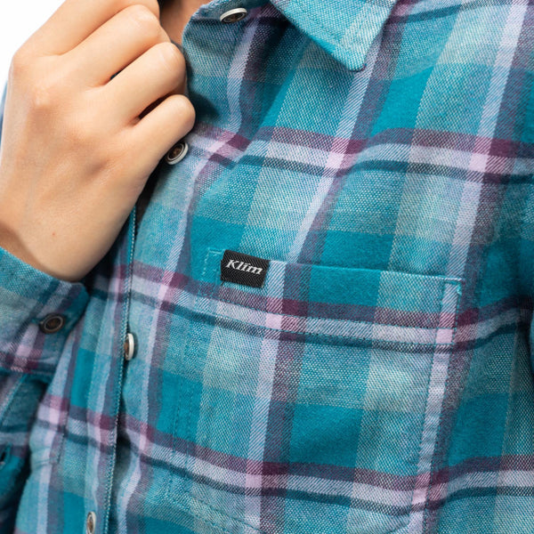 Studio photo on a white background of Klim Sunlight Trail Midweight Flannel Shirt; showing flannel shirt fit, button front, and plaid pattern