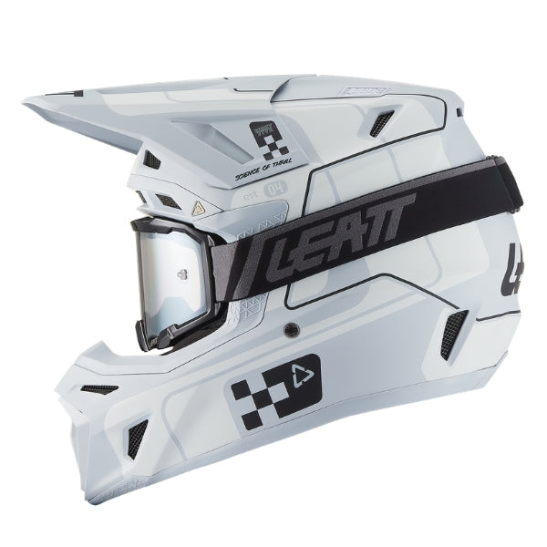 Leatt Moto 8.5 motocross helmet kit in Grey, left-side profile showing the shell graphics with included goggles