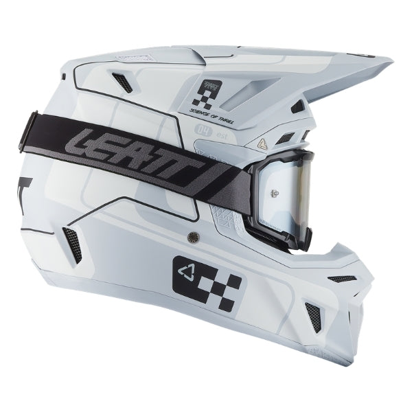 Leatt Moto 8.5 motocross helmet kit in Grey, right-side profile showing the peak and chin guard with included goggles