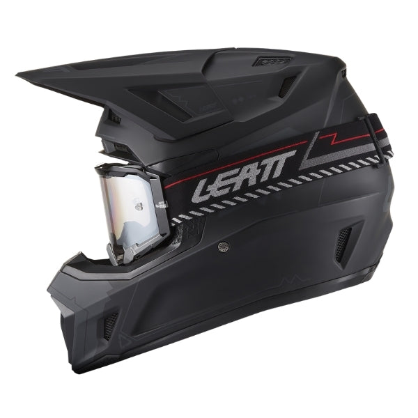 Leatt Moto 7.5 motocross helmet kit in Stealth Black, left-side profile showing the shell graphics with included goggles
