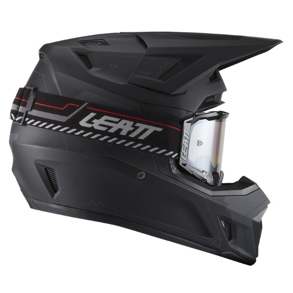 Leatt Moto 7.5 motocross helmet kit in Stealth Black, right-side profile showing the peak and chin guard with included goggles