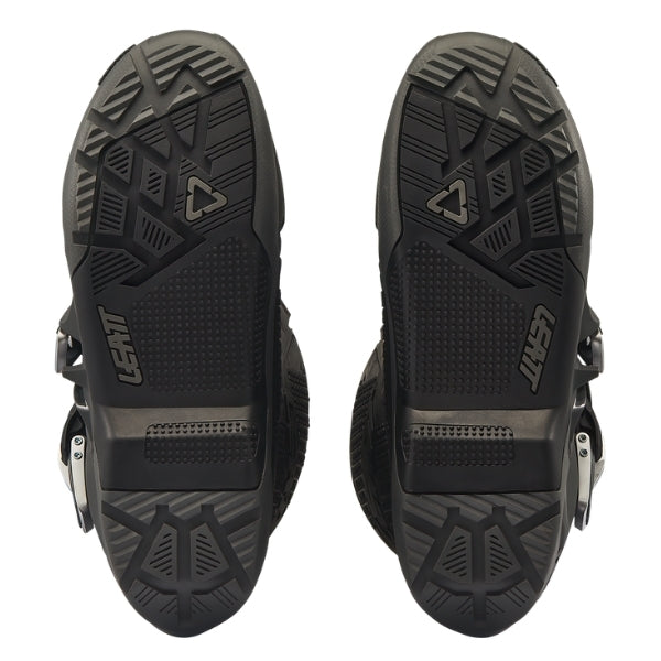 Leatt Moto 5.5 FlexLock Enduro Evo boots in Graphene Black, bottom view showing the tread pattern on both soles