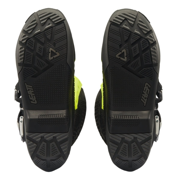 Leatt Moto 5.5 FlexLock Enduro Evo boots in Black/Neon Yellow, bottom view showing the tread pattern on both soles