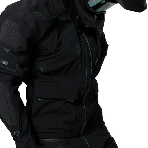 Leatt Moto 6.5 HydraDri Jacket in Black, worn by a rider, showing the fit, sleeves, and chest pockets